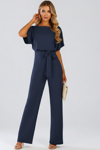 Combinaison femme jambes larges avec ceinture nouée et col rond