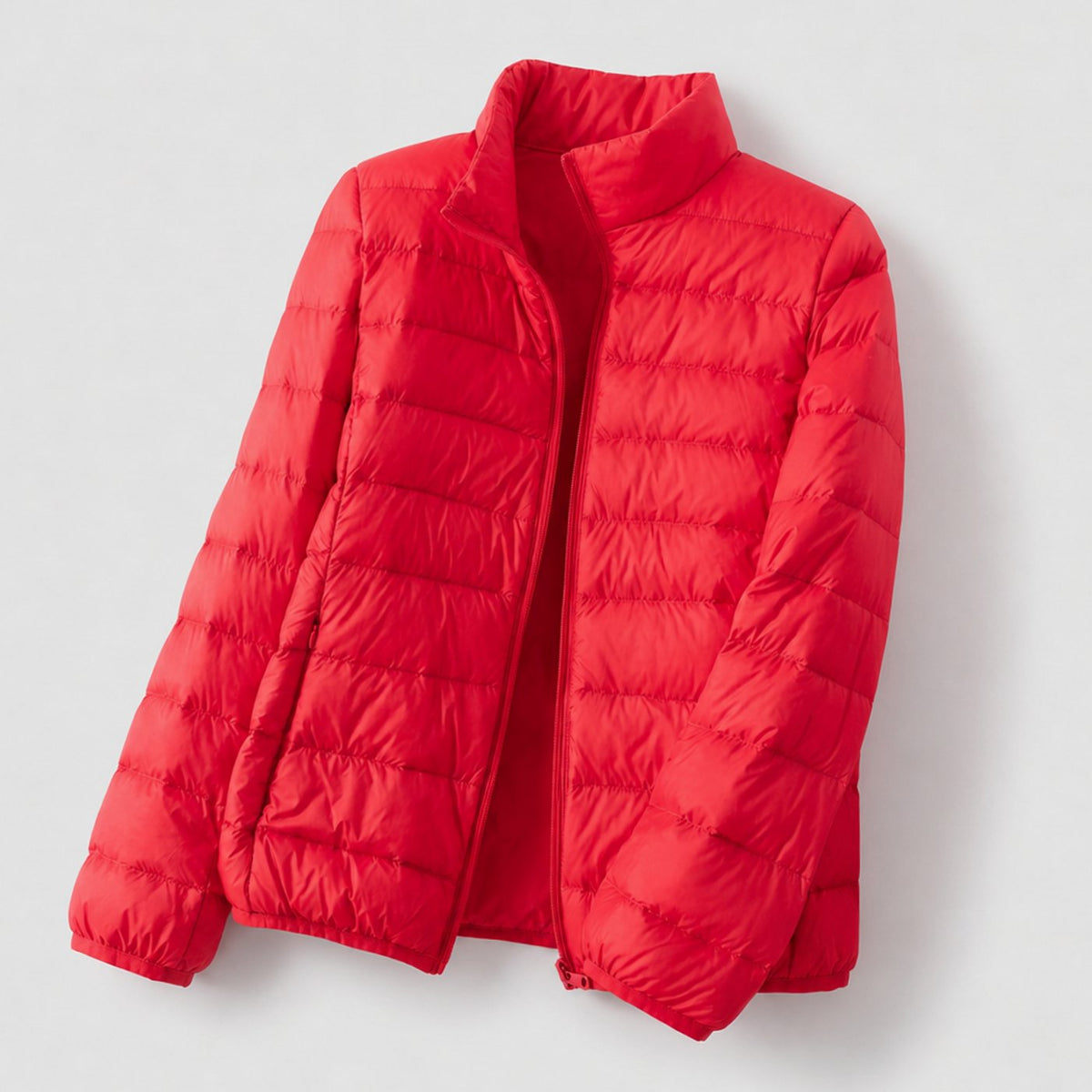 Doudoune légère compressible femme avec duvet d'oie et col montant