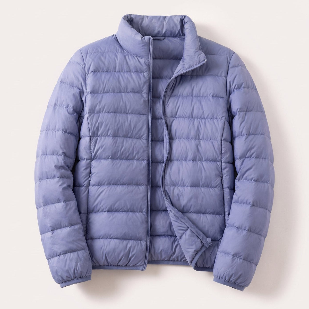 Doudoune légère compressible femme avec duvet d'oie et col montant